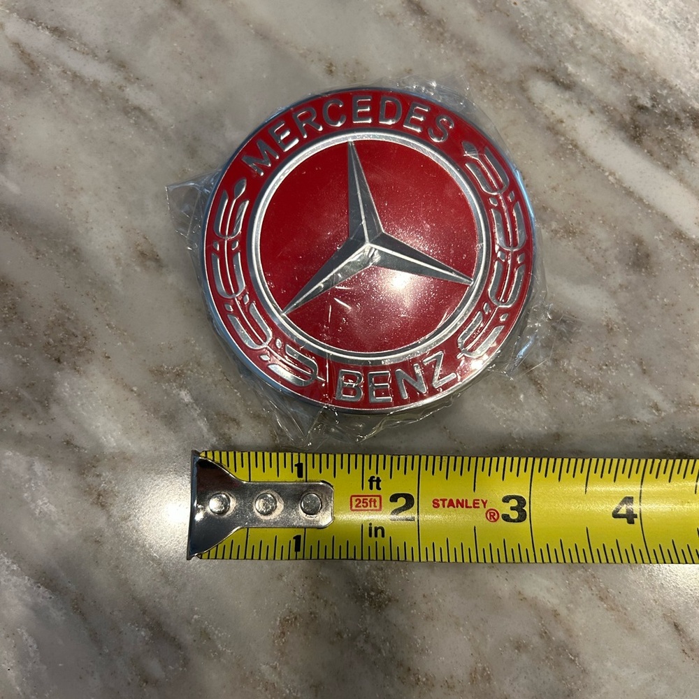 Mercedes-Benz Red and Silver Car Emblem